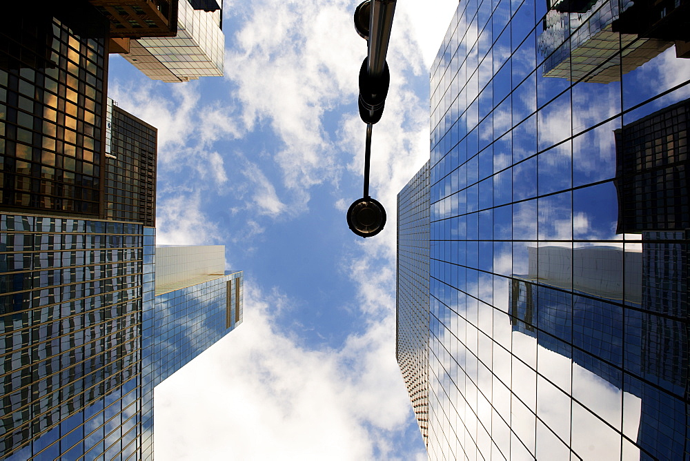 Looking up through skyscrapers, New York, United States of America, North America