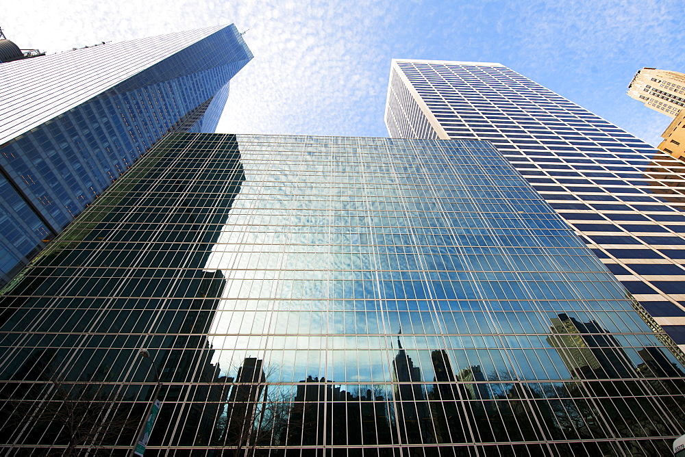 Looking up through skyscrapers, New York, United States of America, North America