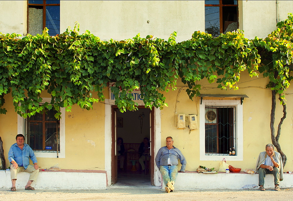 Men wiling away the afternoon, Corsica, Europe