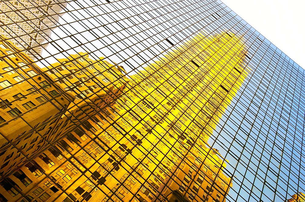 The Chrysler Building reflected in modern glass skyscraper, Lexington Avenue, New York, United States of America, North America