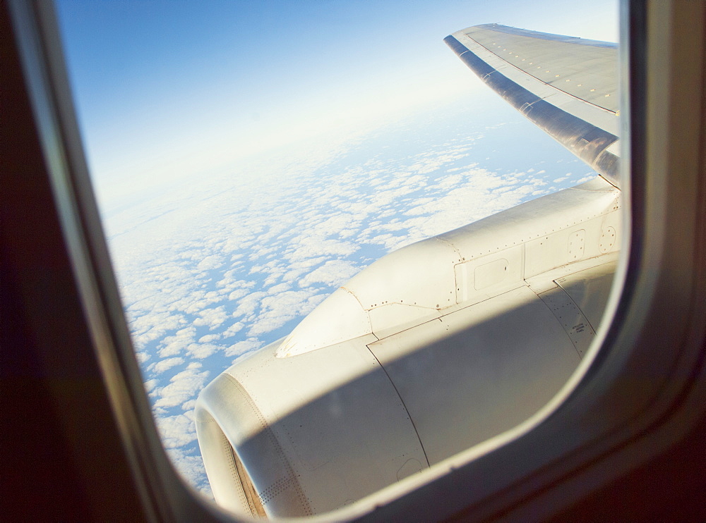 View above the clouds from a plane window, United States of America, North America