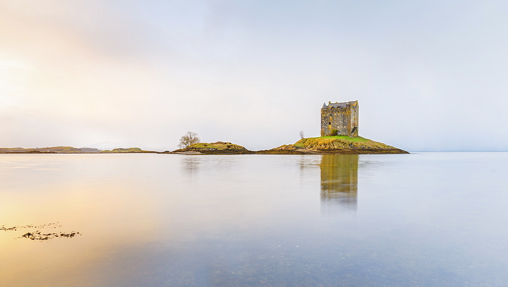 Castle Stalker on its own island in Loch Linnhe surrounded by mist, Argyll, Scottish Highlands, Scotland, United Kingdom, Europe