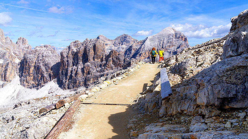 Hikers walking in Monte Lagazuoi, Dolomite mountains, Dolomites, Italy, Europe