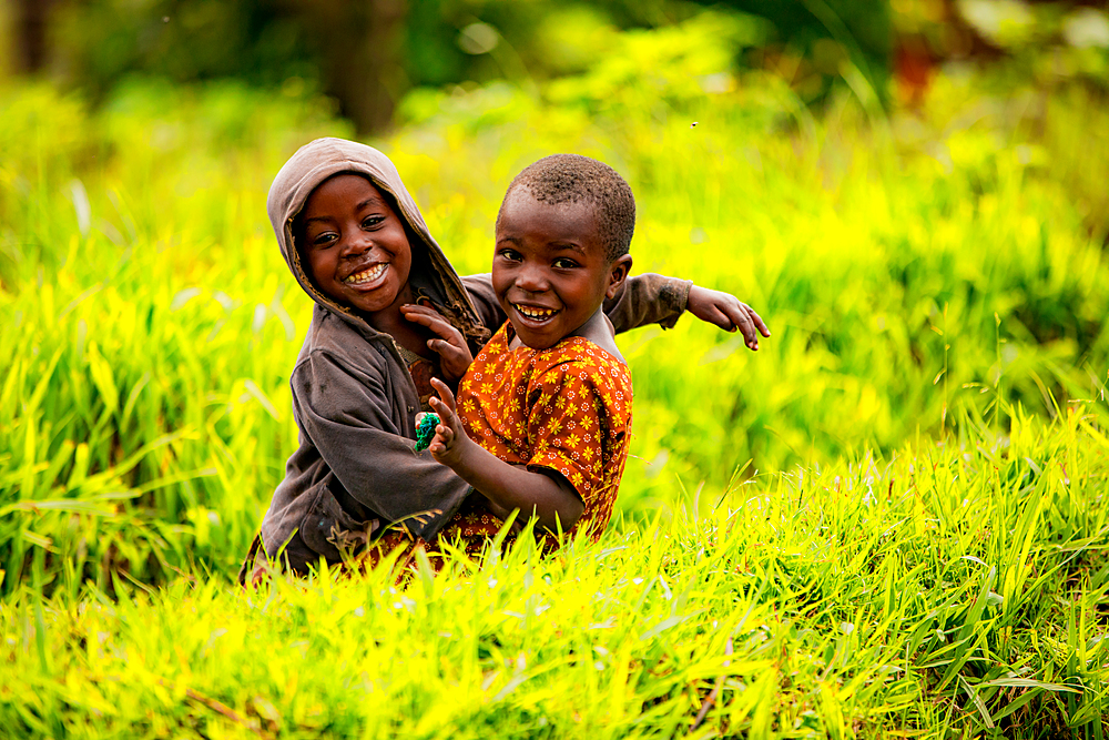 Cute kids posing in Lake Bunyonyi, Uganda, East Africa, Africa