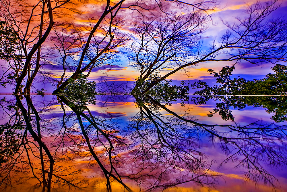 Infinity pool reflection at sunset, Tamarindo, Costa Rica, Central America