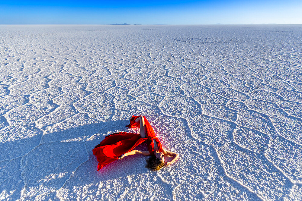 Woman lying on the Uyuni Salt Flats