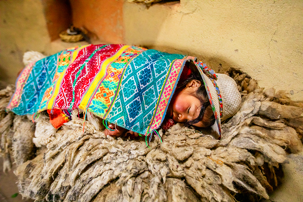 Quechua child sleeping, Ollantaytambo, Peru, South America