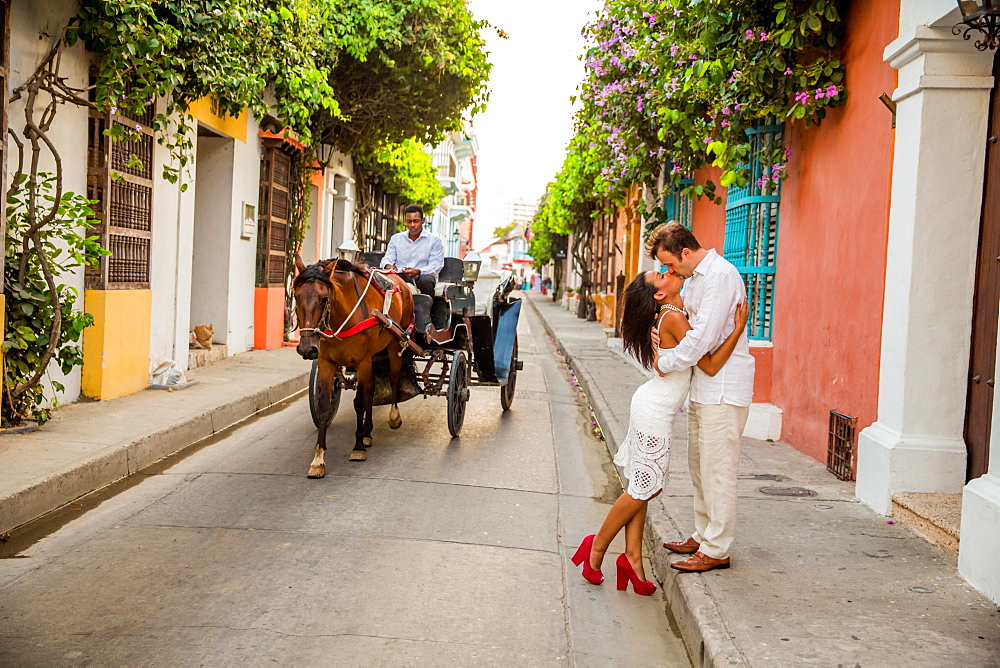 Couple posing in the street, Old Walled-in City, Cartagena, Colombia, South America