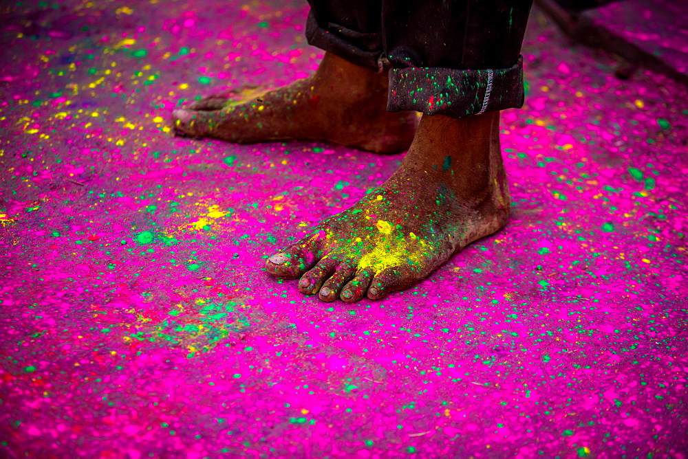 Man's bare feet during the color pigment throwing festival, Holi Festival, Vrindavan, Uttar Pradesh, India, Asia