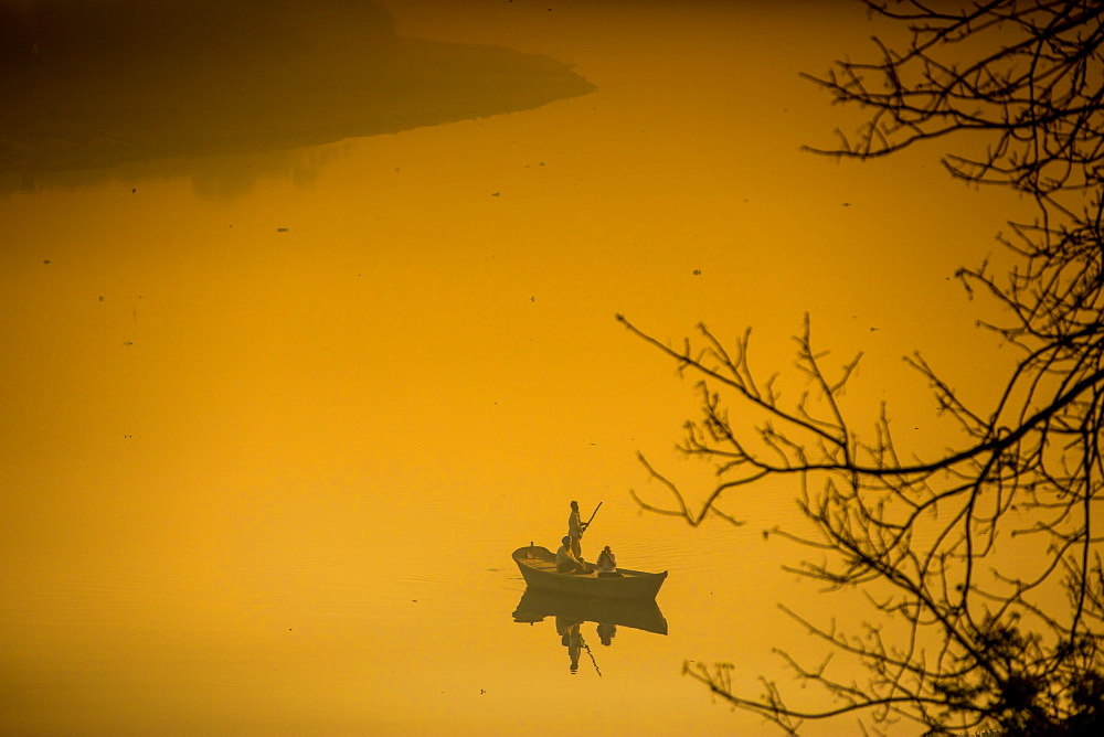 Sunrise over a boat on the Taj Mahal lake, Agra, Uttar Pradesh, India, Asia