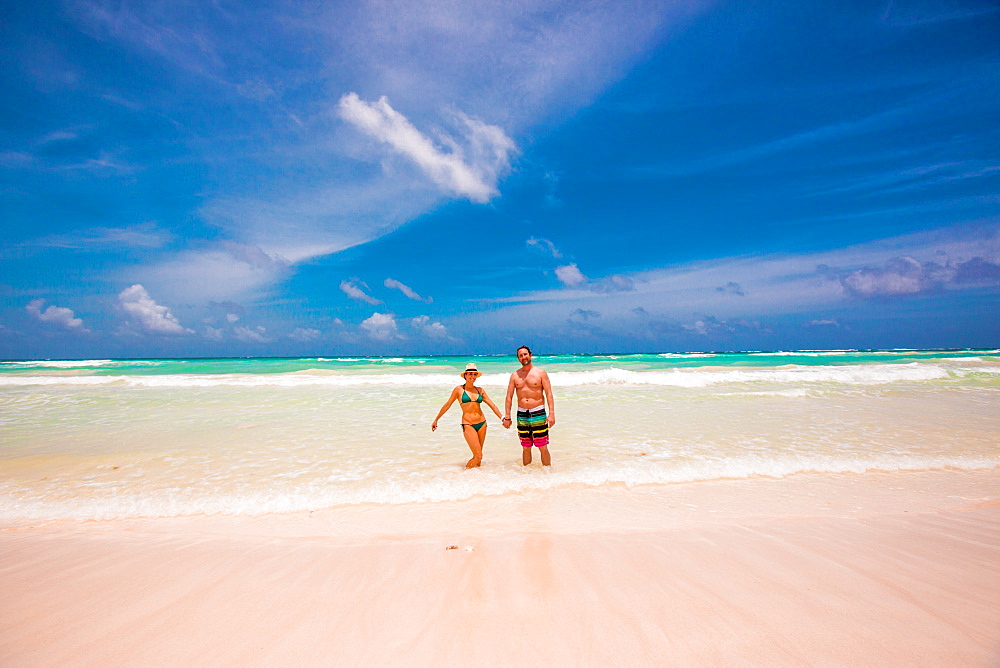 Romantic couple on the beach of Tulum, Mexico, North America