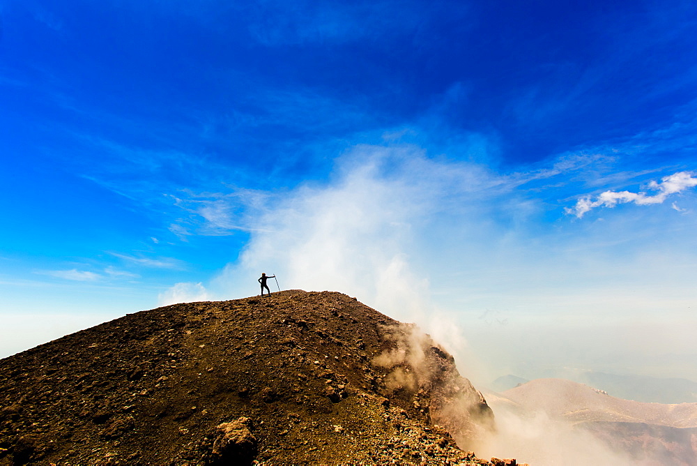 Cresting the peak of Pacaya Volcano in Guatemala City, Guatemala, Central America