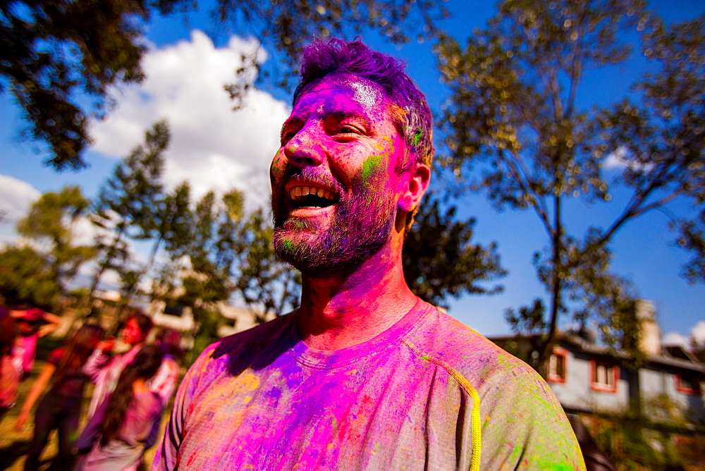 Man with face painted at the Holi Festival, Kathmandu, Nepal, Asia