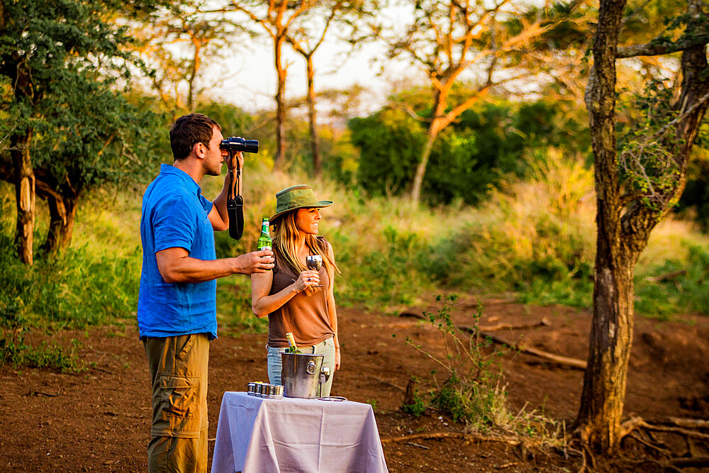 Couple enjoying view at a safari camp, Zululand, South Africa, Africa