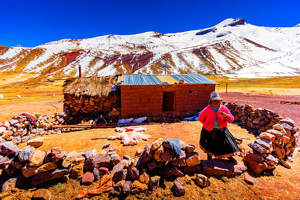 A woman by her shack on Rainbow Mountain, The Andes, Peru, South America