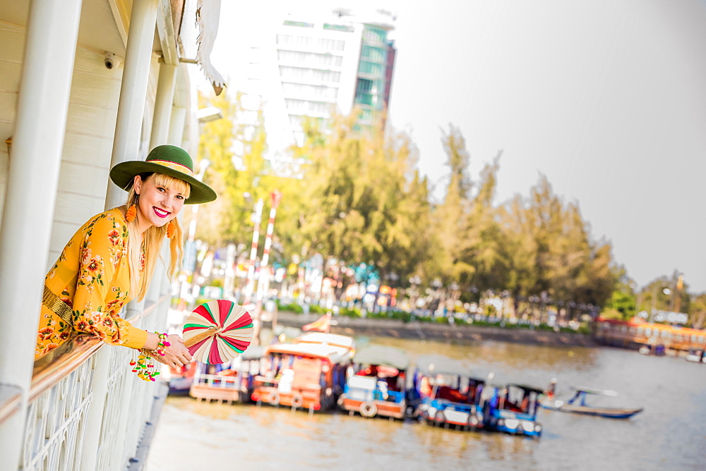 American woman tourist aboard the Mekong Princess as it sails down the Mekong Delta from Cambodia to Vietnam, Indochina, Southeast Asia, Asia