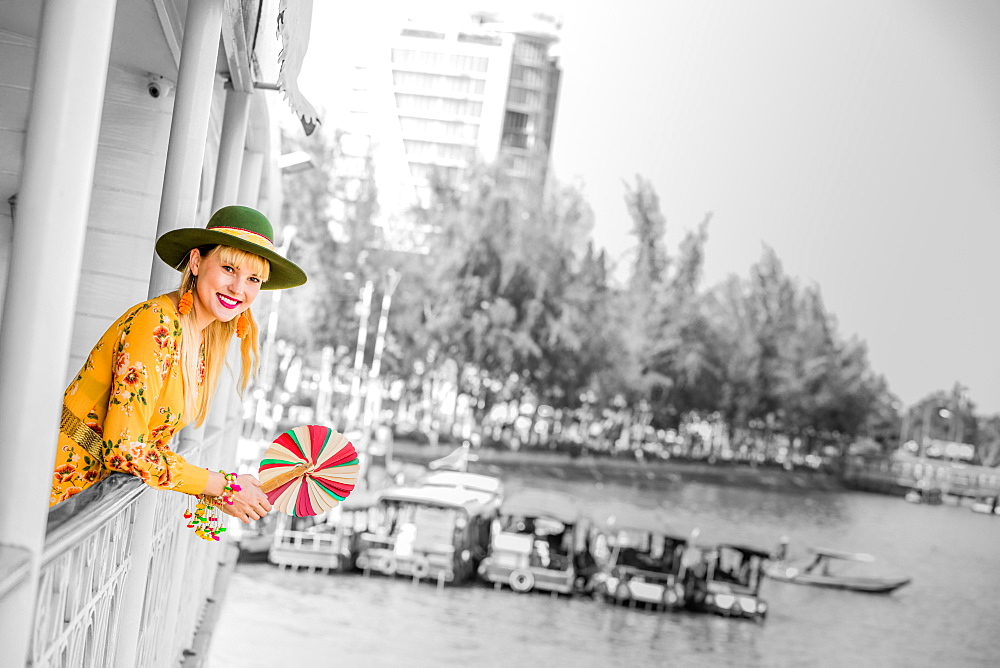 American woman tourist aboard the Mekong Princess as it sails down the Mekong Delta from Cambodia to Vietnam, Indochina, Southeast Asia, Asia