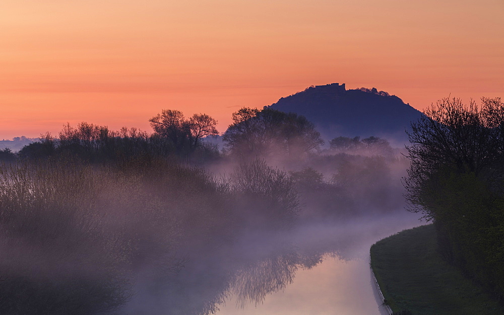 Mist lingers among the trees along the Shropshire Union canal as it snakes its way through the Cheshire plain to Beeston Castle, Cheshire, England, United Kingdom, Europe