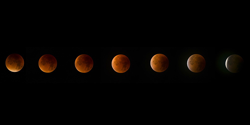 Lunar eclipse, a rare supermoon, blood moon composite phase in the night sky, United Kingdom, Europe