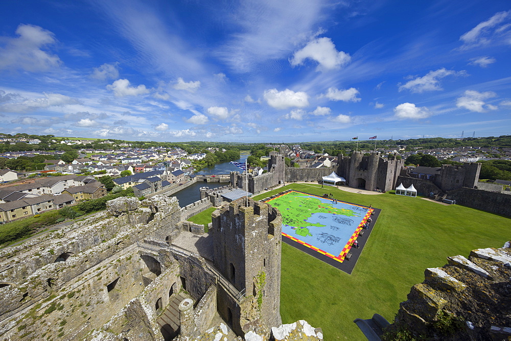 The medieval Pembroke Castle dominates the landscape high above the town and river, Pembroke, Wales, United Kingdom, Europe