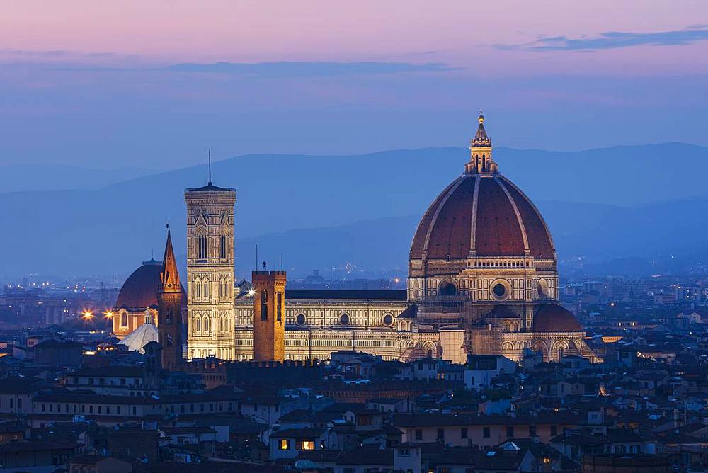 Looking over Florence to the landmarks of the Cathedral (Duomo) (Santa Maria Del Fiore), Campanile and Baptistry lit in the early evening light, Florence, UNESCO World Heritage Site, Tuscany, Italy, Europe