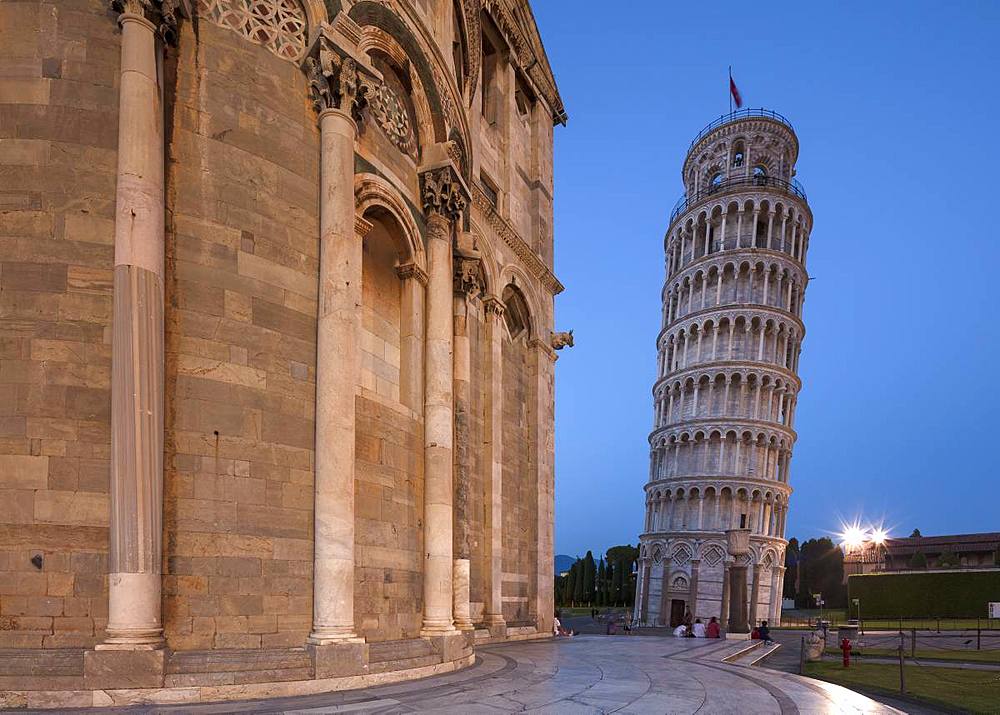 People relaxing on the steps of the Cathedral (Duomo) at twilight with the Leaning Tower of Pisa (Torre Pendente) beyond, UNESCO World Heritage Site, Pisa, Tuscany, Italy, Europe