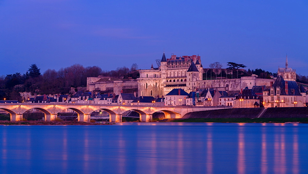 Royal chateau of Amboise lit at dusk on the banks of River Loire, Loire Valley, UNESCO World Heritage Site, Indre et Loire, Pays de la Loire, Centre, France, Europe