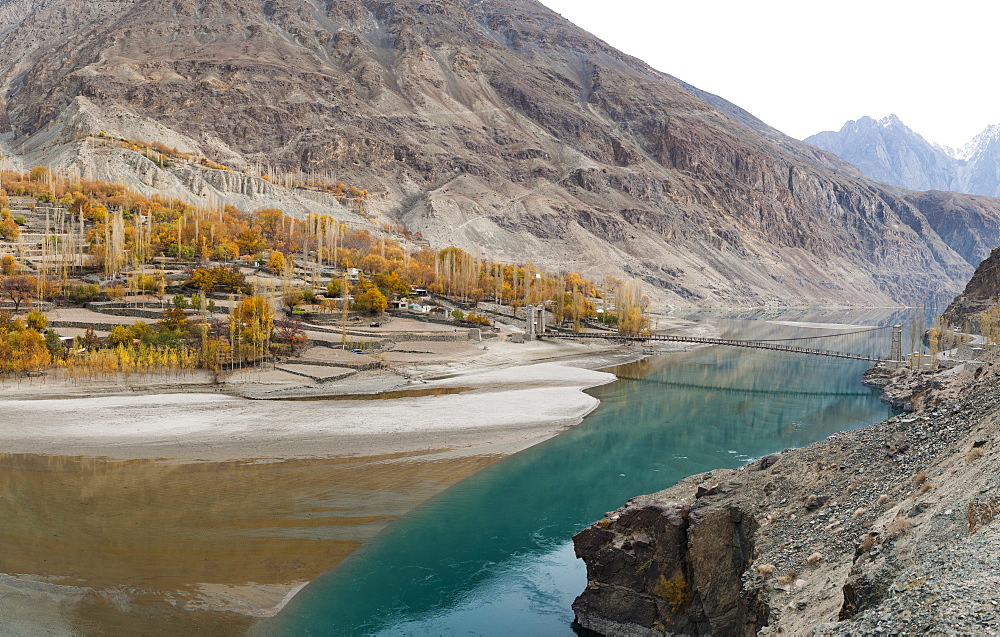 Gupis village on the banks of Khalti Lake which is part of the Gilgit River, seen here from the Shandur-Gilgit road, Ghizer District, in north Pakistan, Asia