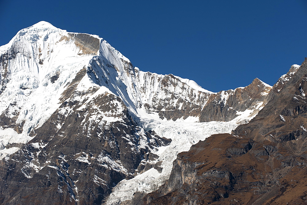 The looming face of Jomolhari, third highest mountain in Bhutan at 7326m, seen from Jangothang, Thimpu District, Bhutan, Himalayas, Asia