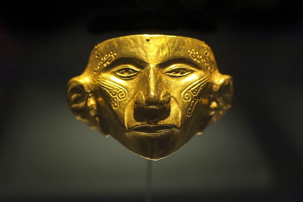 An ancient gold mask at the Museo Del Oro, Bogota, Colombia, South America