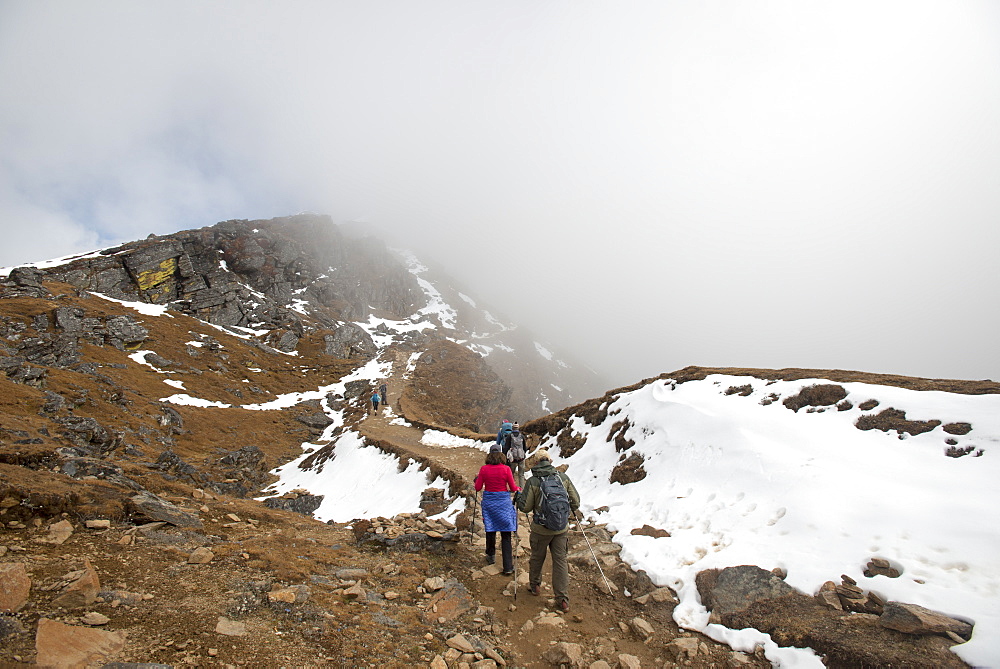 Hiking in the mist on the trail between Sian Gompa and Gosainkund in the Langtang region, Himalayas, Nepal, Asia