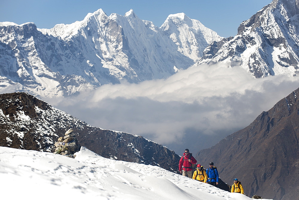 A team of four climbers return to base camp after climbing Ama Dablam in the Nepal Himalayas, Khumbu Region, Nepal, Asia