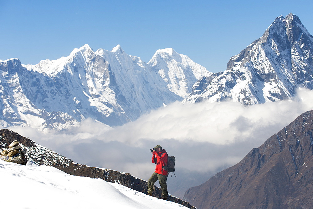 A photographer working in the Everest region of the Nepal Himalayas, Khumbu Region, Nepal, Asia