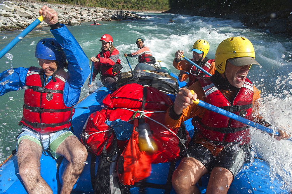 Rafters get splashed as they go through some big rapids on the Karnali River, west Nepal, Asia