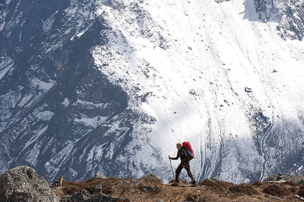 A trekker makes her way to Everest Base Camp, Khumbu Region, Himalayas, Nepal, Asia