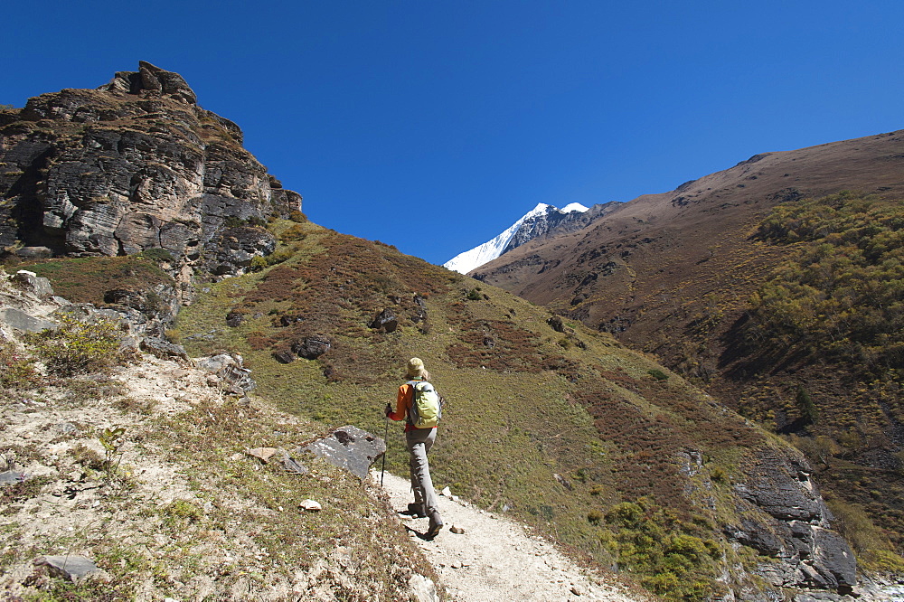 Trekking in the Kagmara Valley with the first glimpse of Lhashama in the distance, Dolpa Region, Himalayas, Nepal, Asia