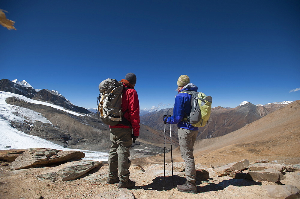 Trekkers at the top of the Kagmara La, the highest point in the Kagmara Valley at 5115m, Dolpa Region, Himalayas, Nepal, Asia