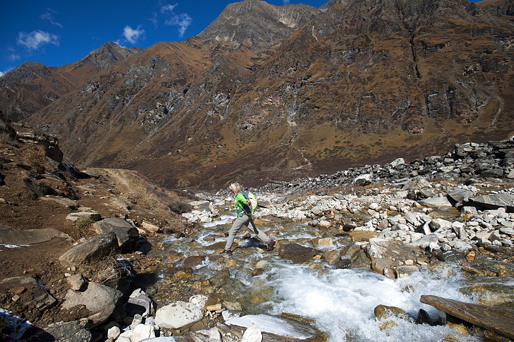 Stepping stones and stream on the trail in the Kagmara Valley, a less trodden path, Dolpa, Nepal, Asia