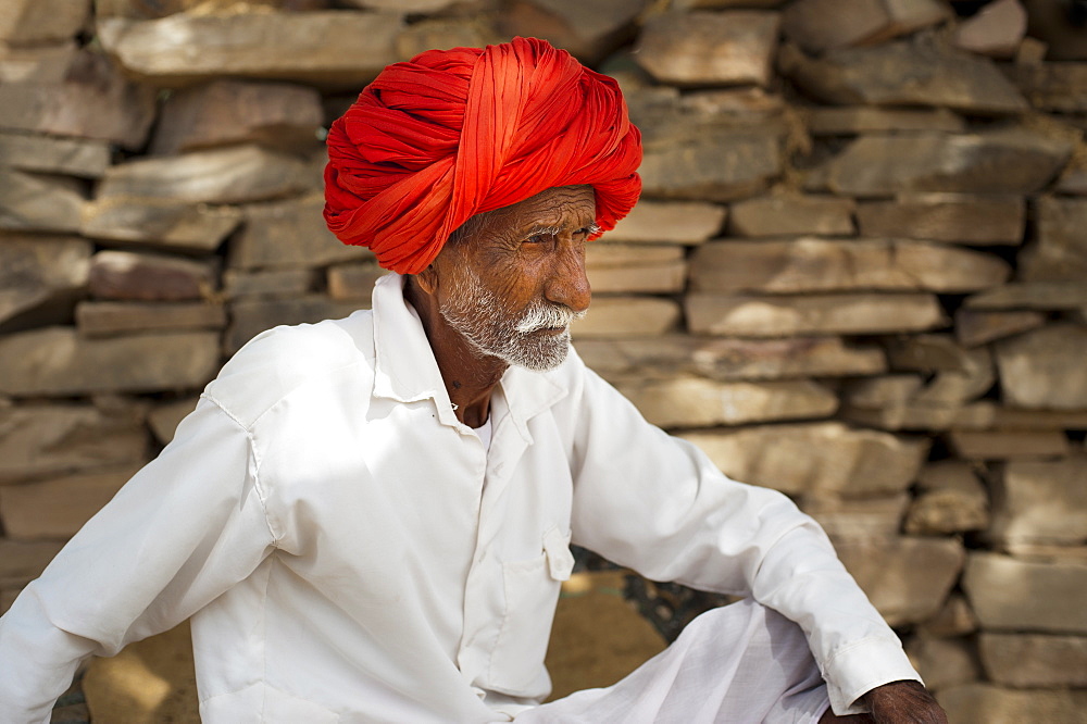 A an old man from Bundi rests during the hot hours of the day, Rajasthan, India, Asia