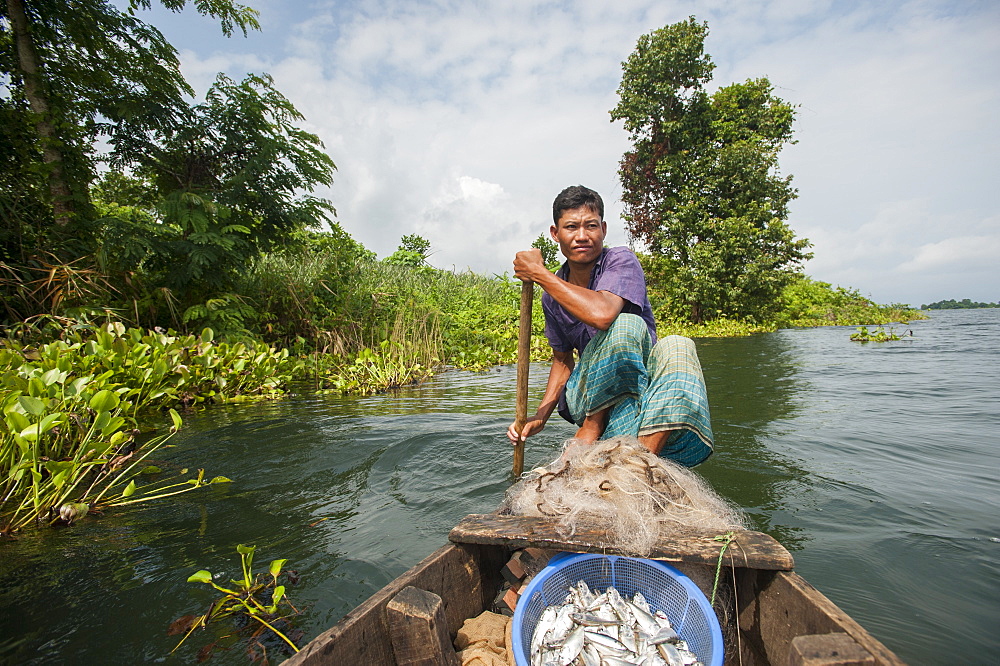 A fisherman on Kaptai Lake in the Chittagong Hill Tracts in Bangladesh, Asia