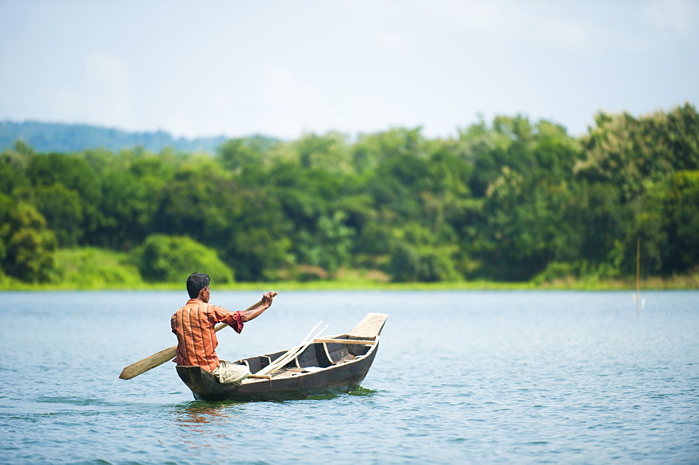 A fisherman on Kaptai Lake in the Chittagong Hill Tracts, Bangladesh, Asia