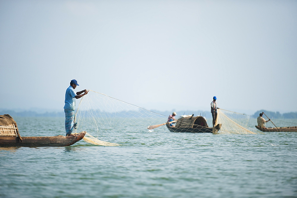 Fishing boats on Kaptai lake in the Chittagong Hill Tracts, Bangladesh, Asia