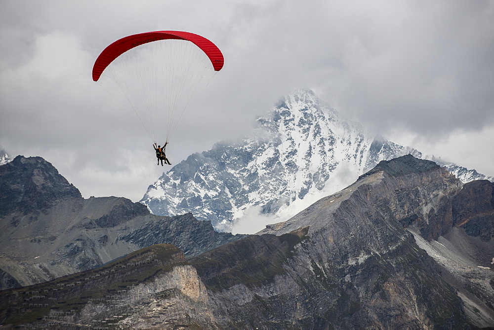 Paragliding in the Swiss Alps near Zermatt, Valais, Switzerland, Europe