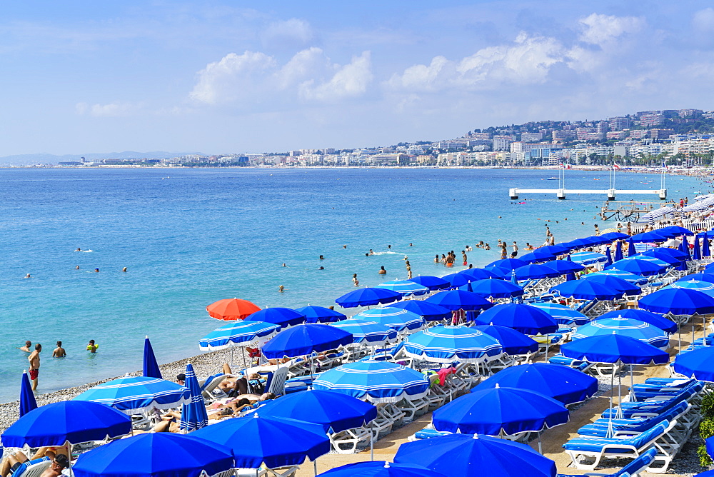 Blue parasols on the beach, Promenade des Anglais, Nice, Alpes Maritimes, Cote d'Azur, Provence, France, Mediterranean, Europe