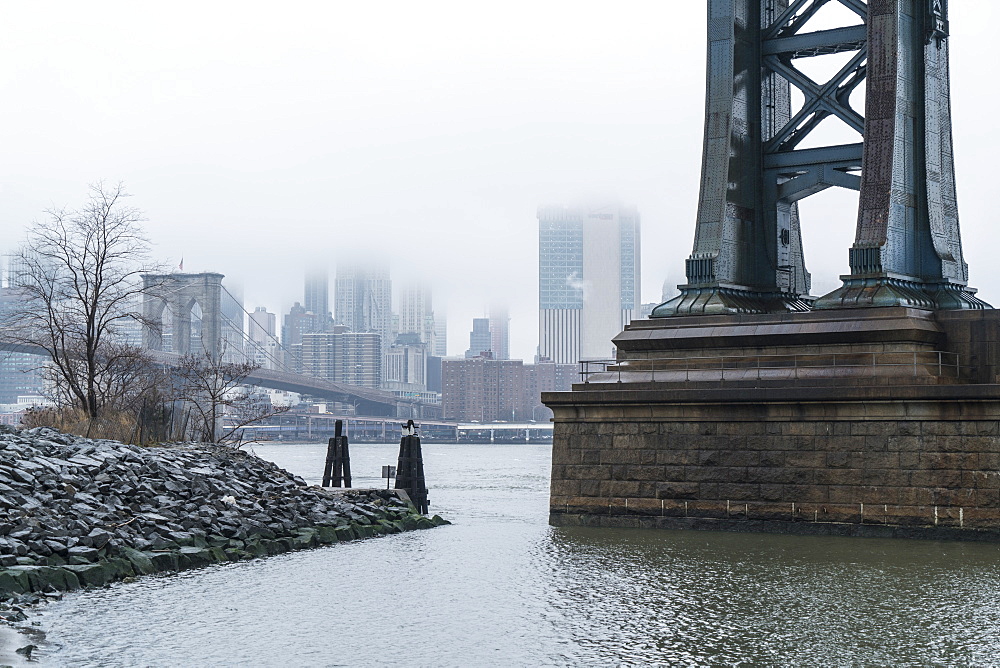 Manhattan Bridge on a cold foggy day, Brooklyn Bridge and skyline beyond, New York City, United States of America, North America