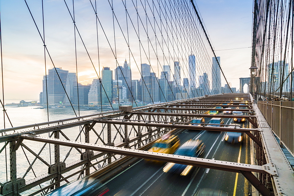 Rush hour traffic on Brooklyn Bridge and Manhattan skyline beyond, New York City, United States of America, North America