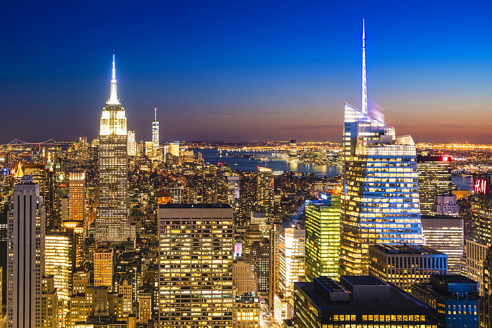 Manhattan skyline and Empire State Building at dusk, New York City, United States of America, North America