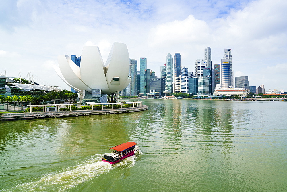 Singapore skyline, financial district skyscrapers with the lotus flower shaped ArtScience Museum in the foreground by Marina Bay, Singapore, Southeast Asia, Asia