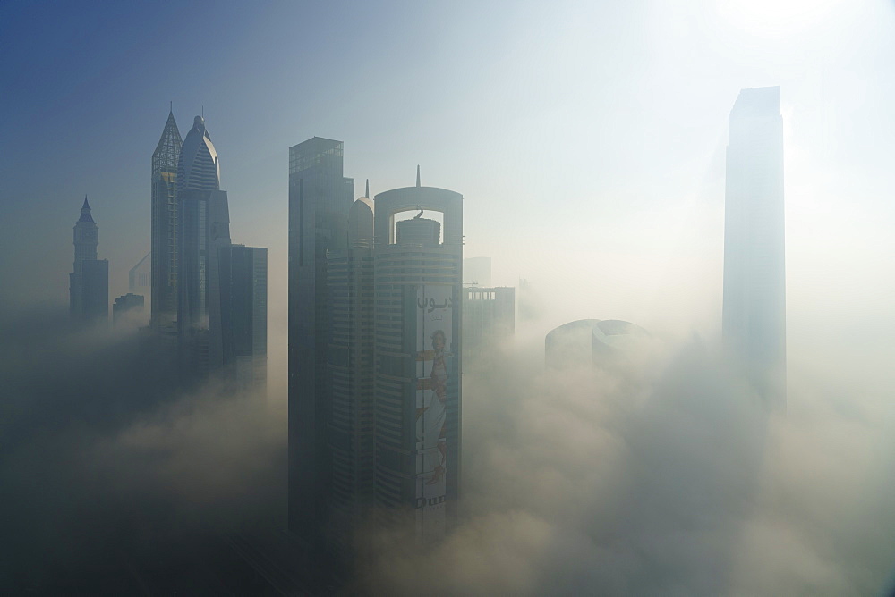 A foggy morning shrouds skyscrapers in Dubai, United Arab Emirates, Middle East