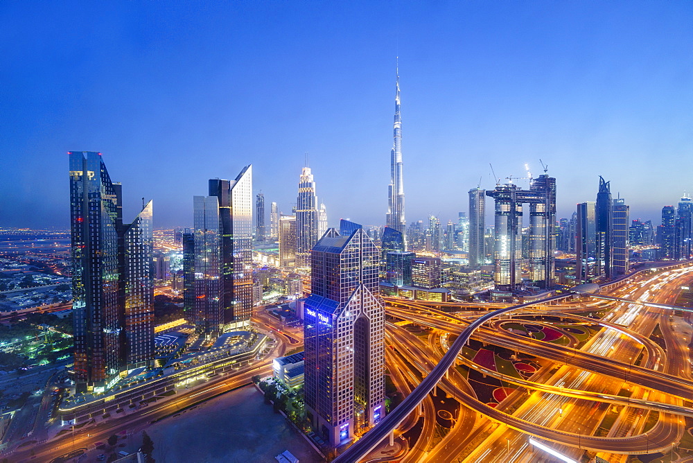 Dubai skyline with Burj Khalifa and Sheikh Zayed Road Interchange, Dubai, United Arab Emirates, Middle East